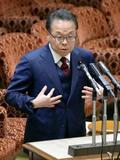 世耕氏、現金還流の再開決定否定